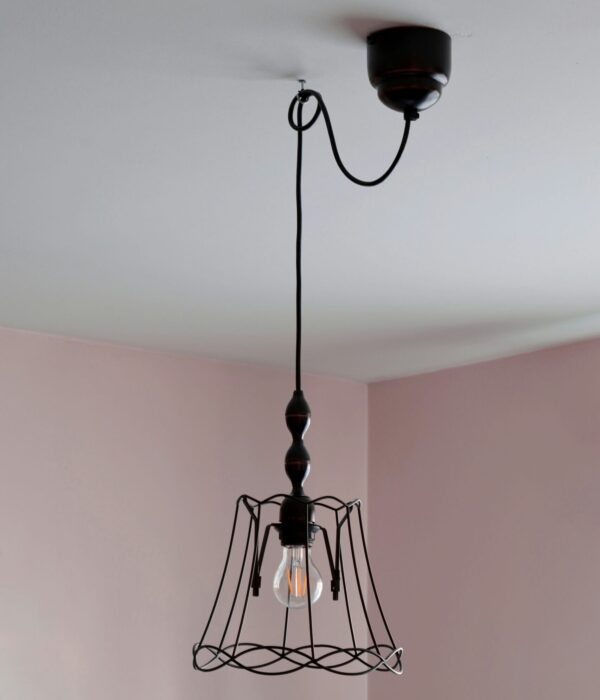 Light fixture extension cord hook